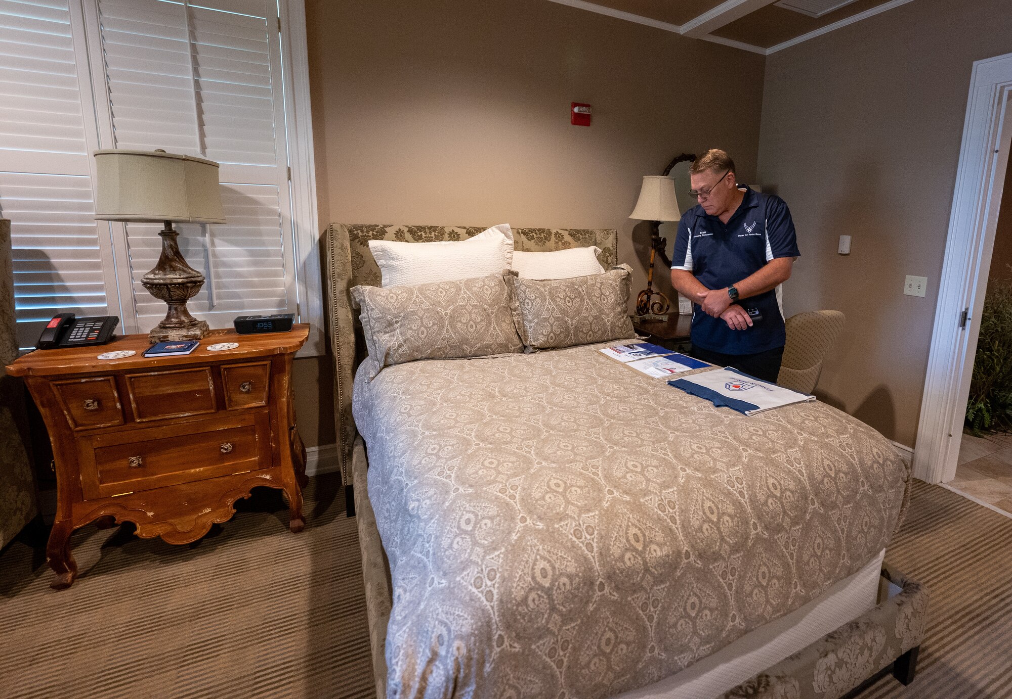 Scott Connell, 436th Operations Support Squadron honorary commander, views the welcome material for families that stay at the Dover Fisher House at Dover Air Force Base, Delaware, July 22, 2022. The Dover AFB Honorary Commanders program helps members of the community understand the importance of the base’s and the Air Force's mission. (U.S. Air Force photo by Jason Minto)