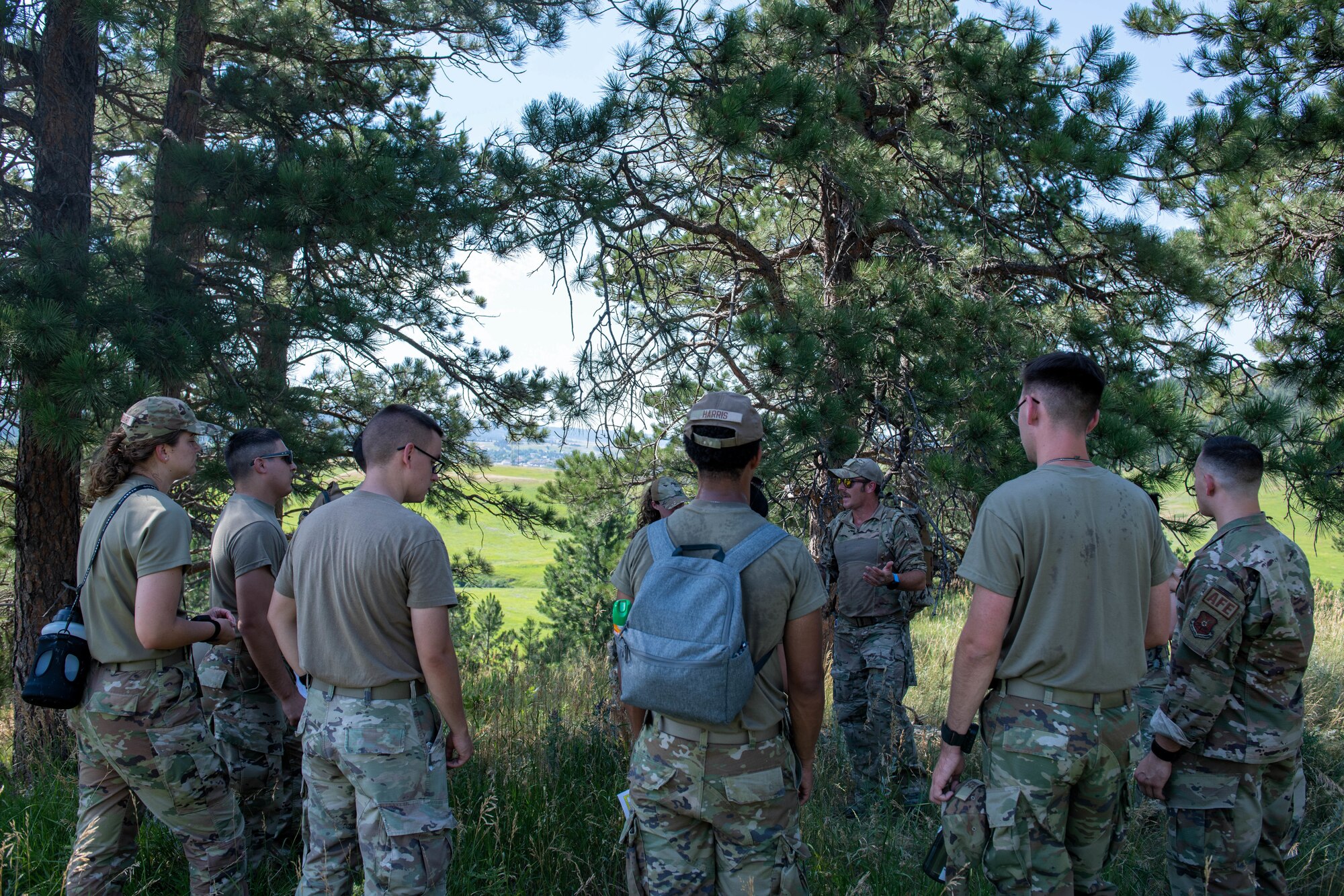 U.S. Air Force Airmen assigned to the 28th Bomb Wing receive instruction during the first iteration of the Ellsworth Outdoor Survival Skills Course at the Fort Meade Training Area, S.D., July 21, 2022