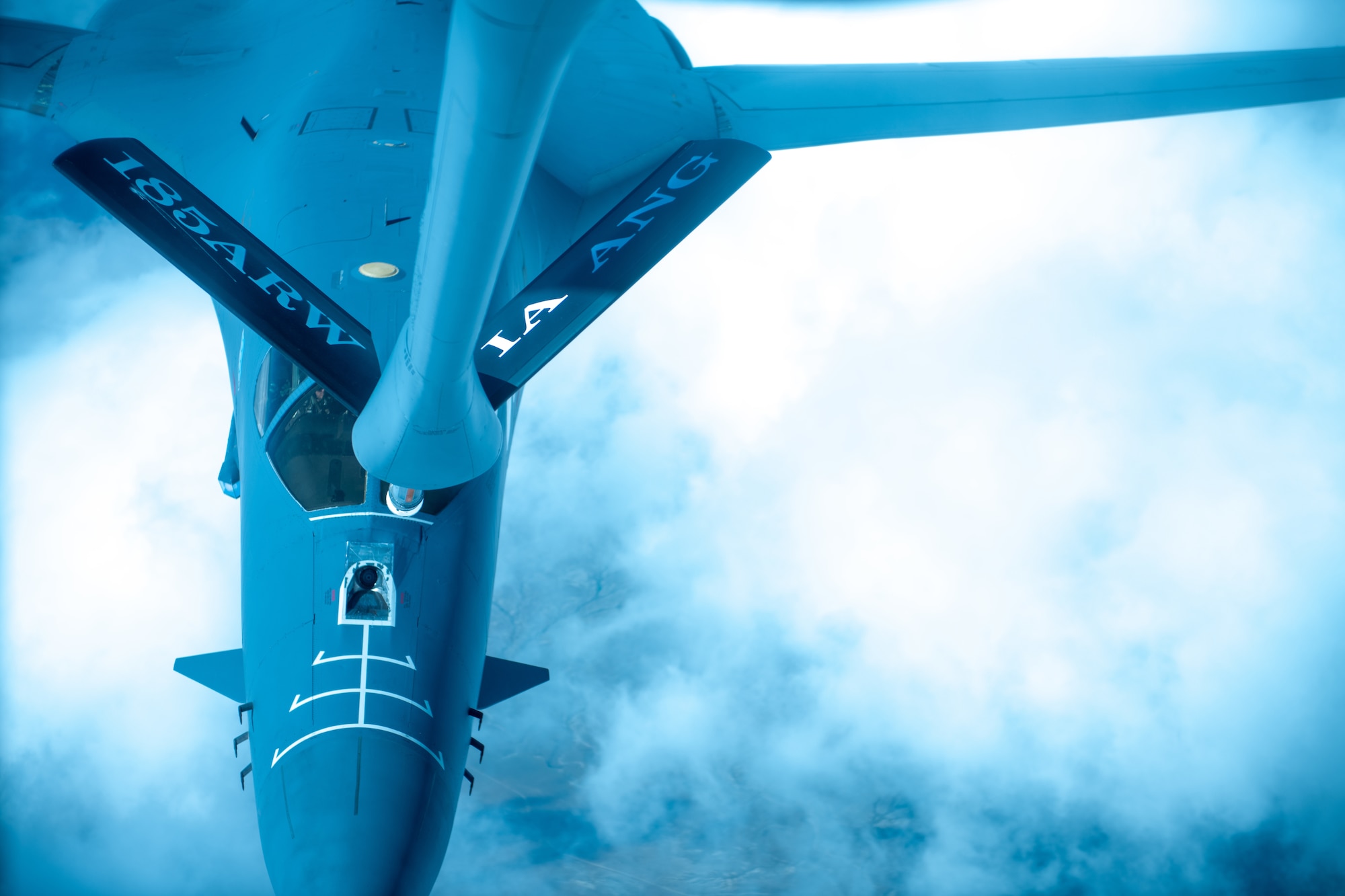 A B-1B Lancer, assigned to Ellsworth Air Force Base, S.D., approaches a KC-135 Stratotanker, assigned to the 185th Air Refueling Wing, Iowa Air National Guard, during an airborne refueling exercise in the Powder River Training Complex air space, July 21, 2022.