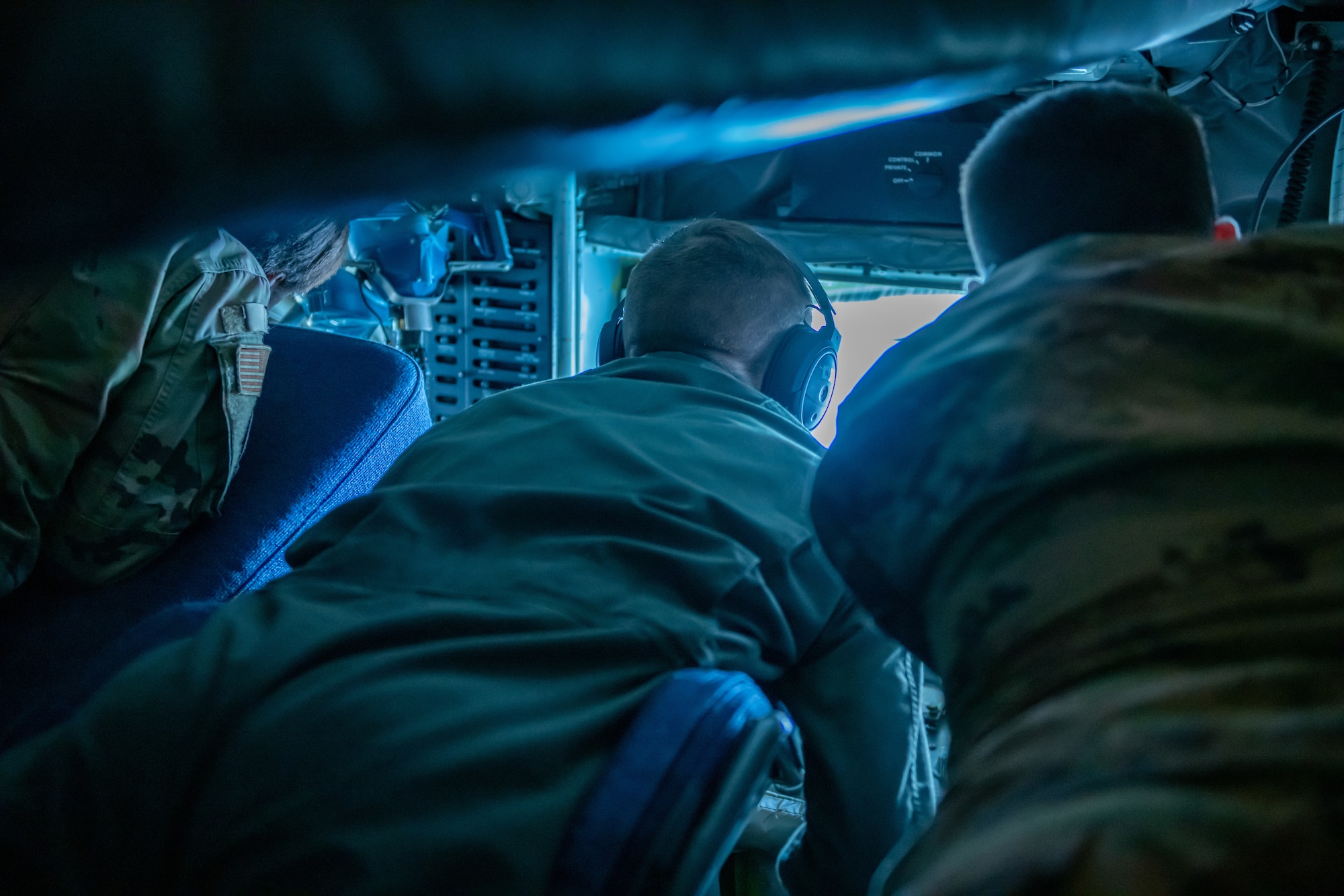 U.S. Air Force service members, assigned to Ellsworth Air Force Base, S.D., observe aerial refueling aboard a KC-135 Stratotanker, assigned to the Iowa Air National Guard 185th Air Refueling Wing, in Powder River Training Complex, S.D., July 21, 2022.