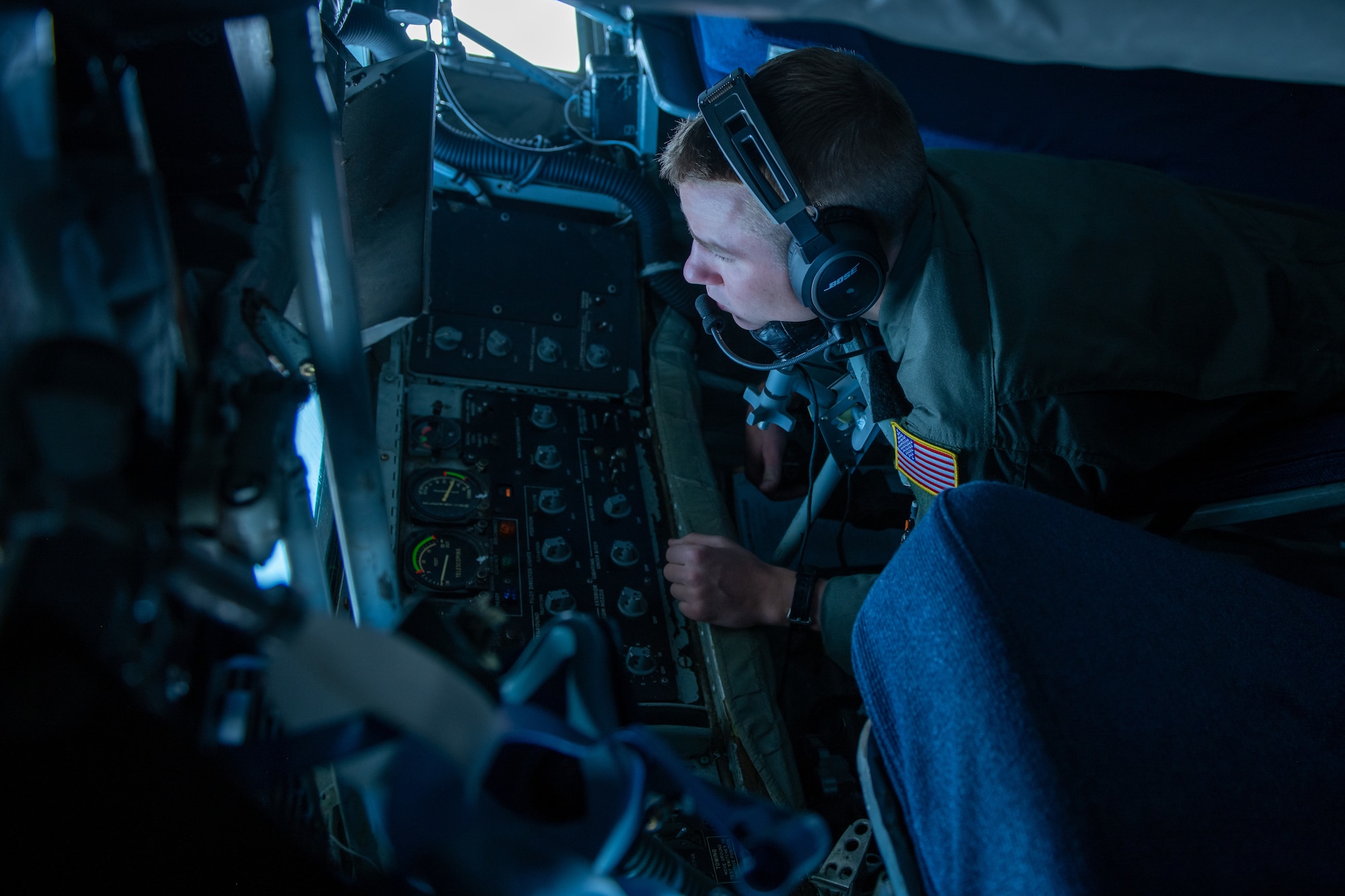 An Iowa Air National Guard boom operator, assigned to the 185th Air Refueling Wing, executes in-flight refueling in the Powder River Training Complex air space, July 21, 2022.