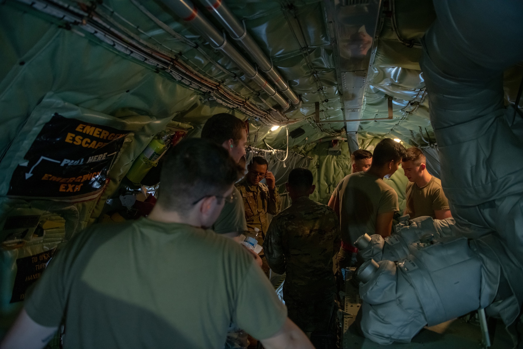 U.S. Air Force Airmen from Ellsworth Air Force Base, S.D., receive an in-flight tour of a KC-135 Stratotanker assigned to the 185th Air Refueling Wing, Iowa Air National Guard, during an airborne refueling exercise near Rapid City, S.D., July 21, 2022.