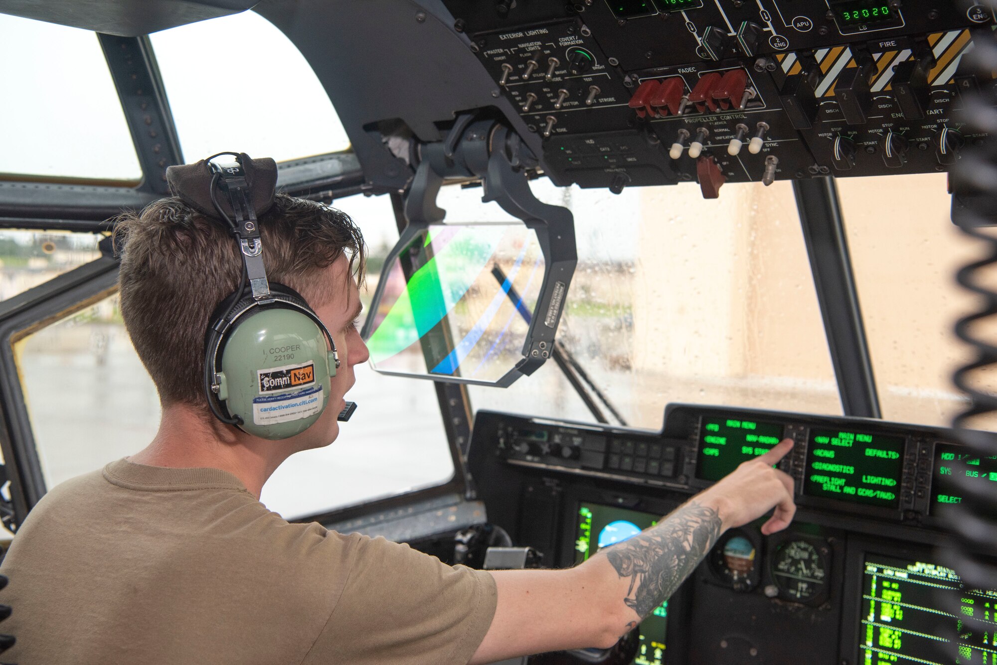 Senior Airman Isaac Cooper, 374th Aircraft Maintenance Squadron integrated communication, navigation, electronic countermeasure journeyman, verifies navigational equipment is working in order at Yokota Air Base, Japan, July 26, 2022.