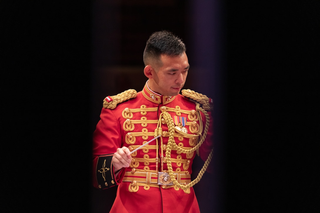 The 1st Lt. Darren Y. Lin conducts the Marine Chamber Orchestra in concert at the Rachel M. Schlesinger Concert Hall and Arts Center at Northern Virginia Community College in Alexandria, Va. on July 23, 2022. (U.S. Marine Corps photo by Staff Sgt. Chase Baran/released)