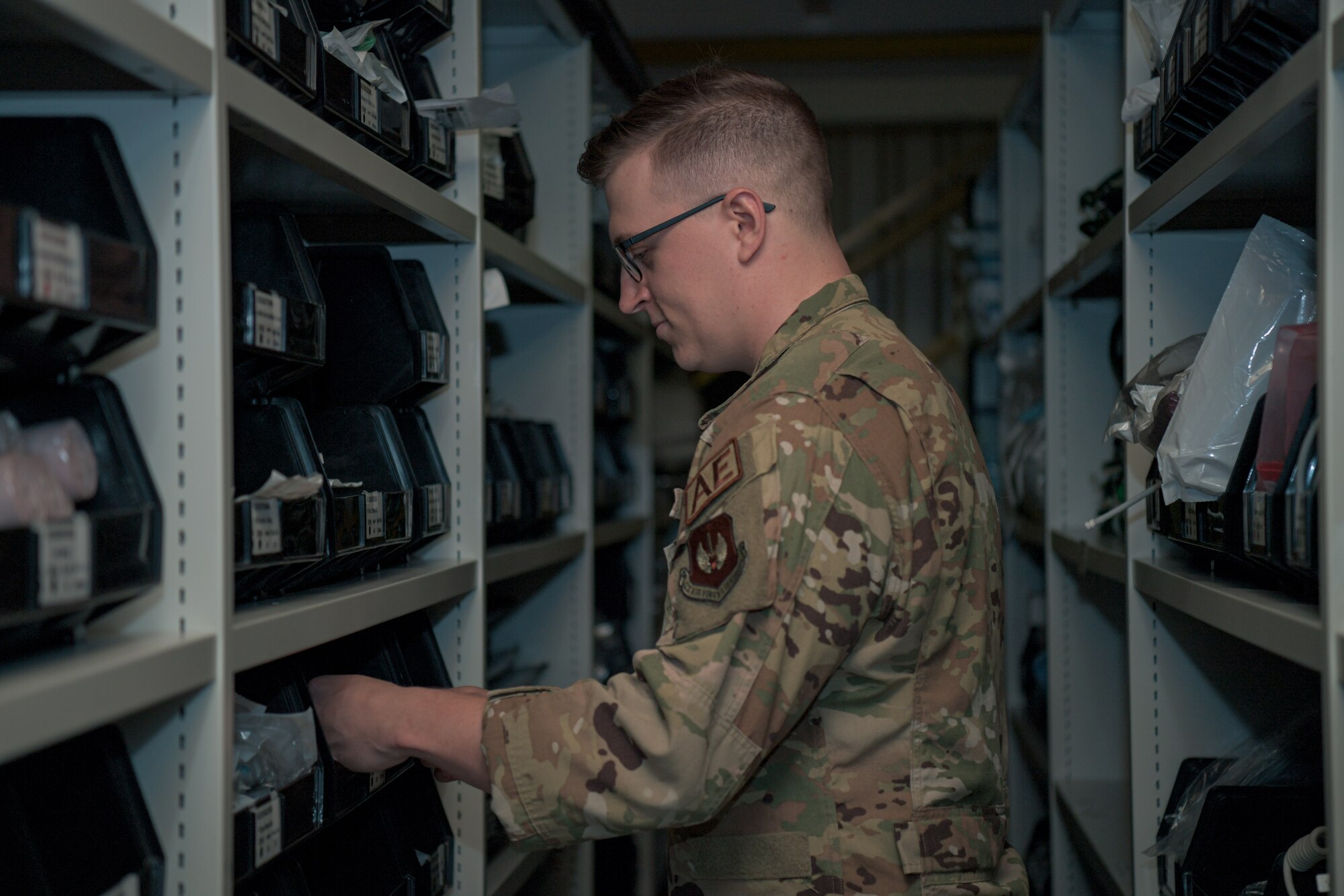 man looks through inventory