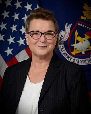 woman standing in front of flags.