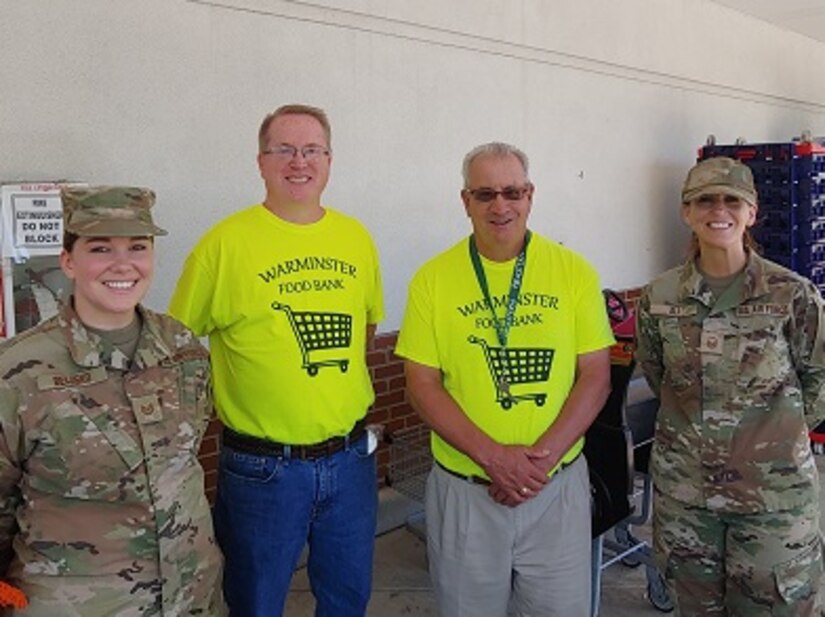 Pennsylvania Air National Guard Master Sgt. Rachel M. Ali (right) and Tech. Sgt. Shawna Belusko (left), both Production Recruiters with the 111th Attack Wing based at Biddle Air National Guard Base in Horsham, Pennsylvania stand with members of the Warminster Food Bank during a food drive at a local supermarket in Warminster, Pennsylvania. The event, dubbed “Stuff the Humvee,” helped the food bank gather more than 2000 pounds of non-perishable food items to support families in need in the surrounding communities. (Courtesy photo from Warminster Food Bank)