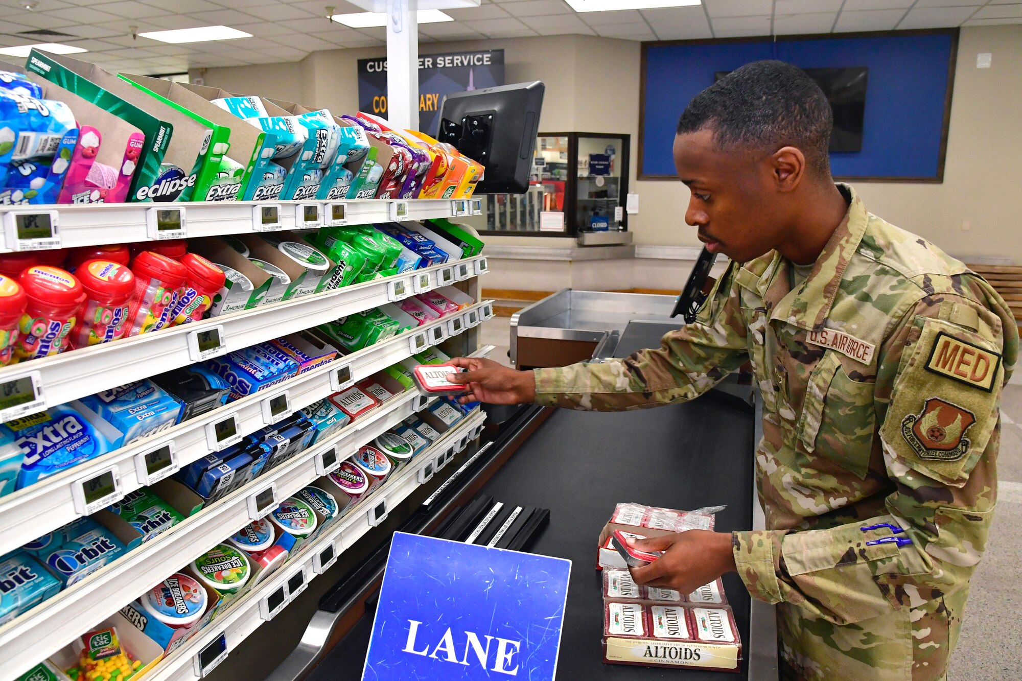 Airman 1st Class Miles Lee, 75th Operational Readiness Medical Squadron, stocks shelves at the base Commissary July 26, 2022, at Hill Air Force Base, Utah. Organized by the Air Force Sergeants Associations Chapter 1163, Airmen from across the installation have been volunteering to restock shelves at the store. (U.S. Air Force photo by Todd Cromar)
