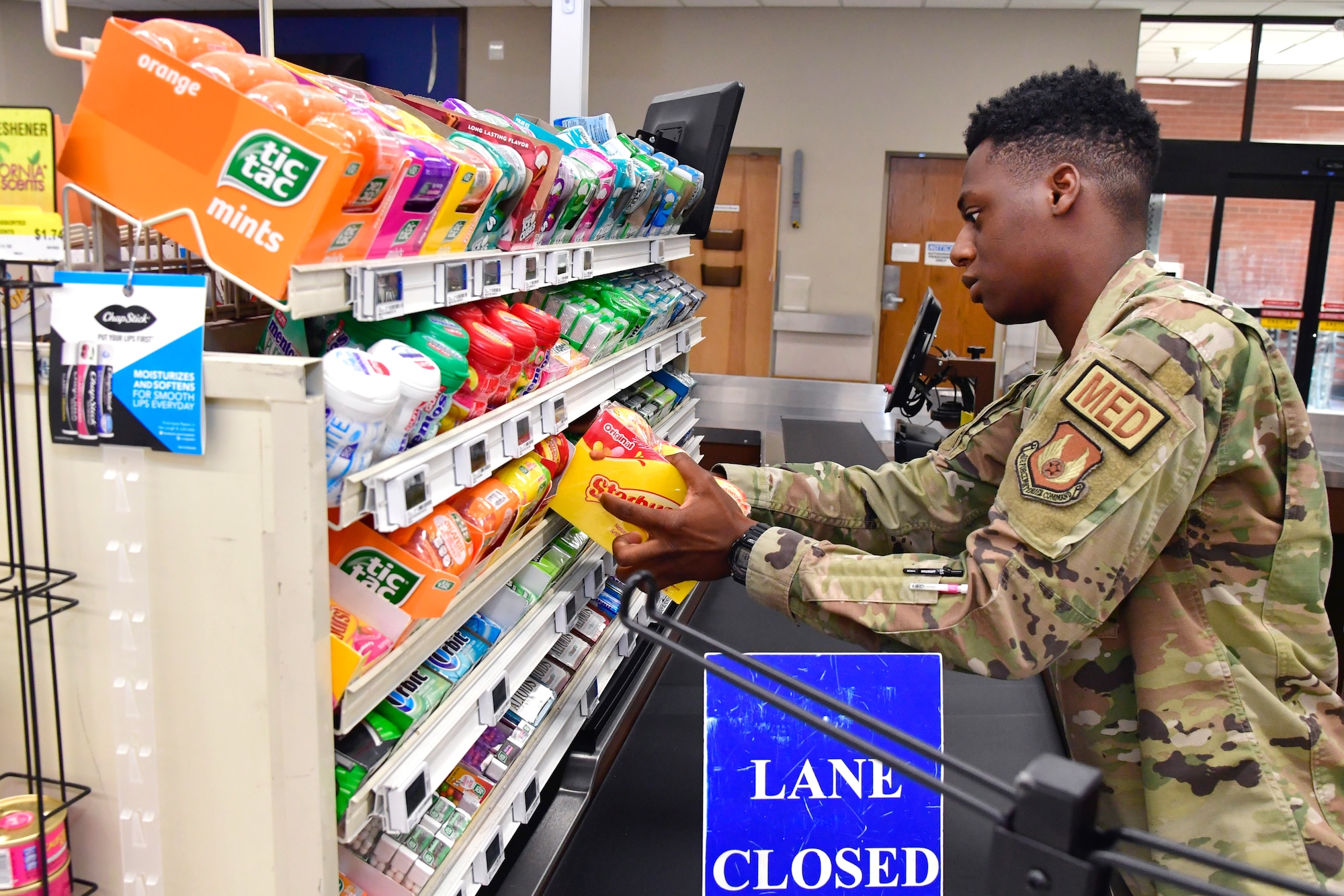 Airman 1st Class Ladarius Musonda, 75th Operational Readiness Medical Squadron, stocks shelves at the base Commissary July 26, 2022, at Hill Air Force Base, Utah. Organized by the Air Force Sergeants Associations Chapter 1163, Airmen from across the installation have been volunteering to restock shelves at the store. (U.S. Air Force photo by Todd Cromar)