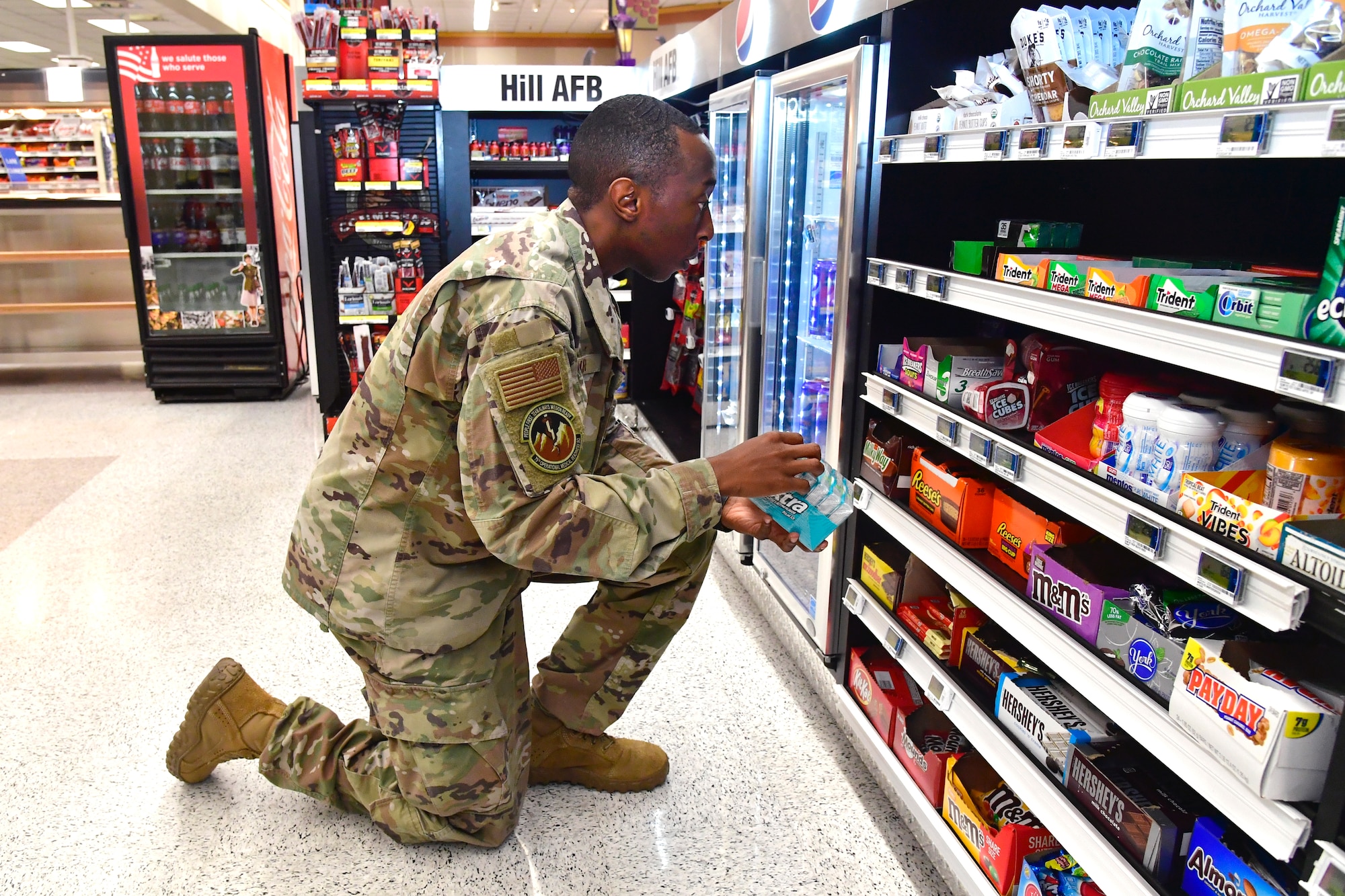 Senior Airman Donald Lamar, 75th Operational Readiness Medical Squadron, stocks shelves at the base Commissary July 26, 2022, at Hill Air Force Base, Utah. Organized by the Air Force Sergeants Associations Chapter 1163, Airmen from across the installation have been volunteering to restock shelves at the store. (U.S. Air Force photo by Todd Cromar)