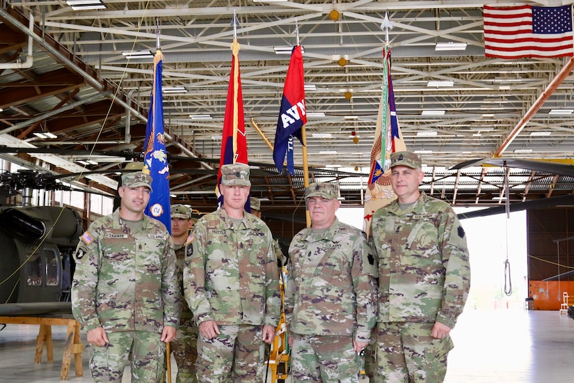 U.S. Soldiers with the 28th Expeditionary Combat Aviation Brigade, family and friends gather for a change of responsibility ceremony at Muir Army Airfield. During the ceremony, Command Sgt. Maj. Sean Livolsi passed the brigade’s senior enlisted leader responsibilities to Command Sgt. Maj. Jeff Huttle.