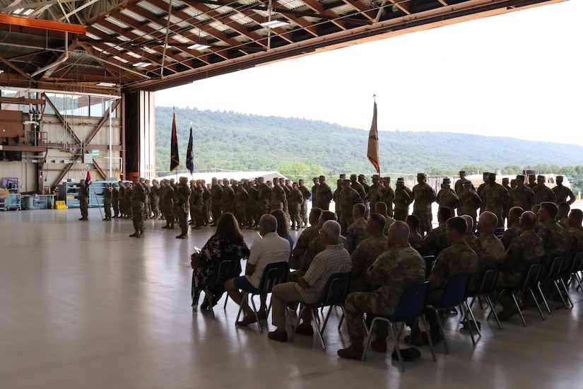 U.S. Soldiers with the 28th Expeditionary Combat Aviation Brigade, family and friends gather for a change of responsibility ceremony at Muir Army Airfield. During the ceremony, Command Sgt. Maj. Sean Livolsi passed the brigade’s senior enlisted leader responsibilities to Command Sgt. Maj. Jeff Huttle.