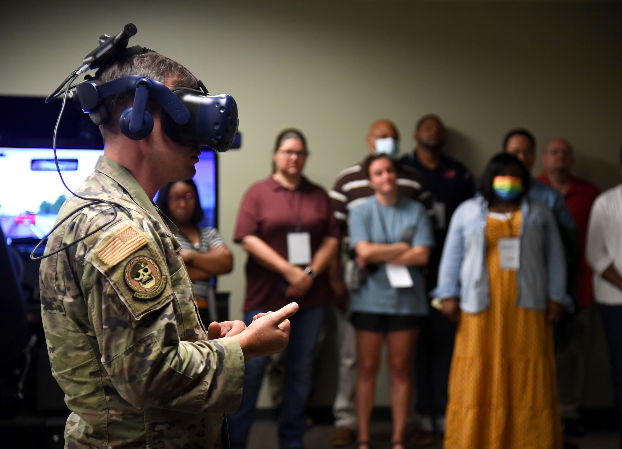 U.S. Air Force Staff Sgt. John James, 81st Security Forces Squadron unit trainer, provides a virtual reality training demonstration during the Mississippi Educators Tour for Law and Public Safety and Fire Science tour inside the 403rd Security Forces Squadron Combat Arms building at Keesler Air Force Base, Mississippi, July 27, 2022. More than 30 educators also toured the Keesler Fire Department and received a military working dog demonstration. (U.S. Air Force photo by Kemberly Groue)