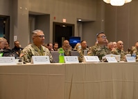 Joint Task Force Civil Support commanding general, U.S. Army Maj. Gen. Jeff Van, left, and Task Force 46 commanding general Maj. Gen. Pablo Estrada Jr. listen to presentations from local, state, federal, academic, U.S. military, private sector and international homeland defense and defense support of civil authority partners in Philadelphia, during the Task Force 46 Multi-Domain Operations Dense Urban Terrain Exercise 2022, July 26, 2022.
