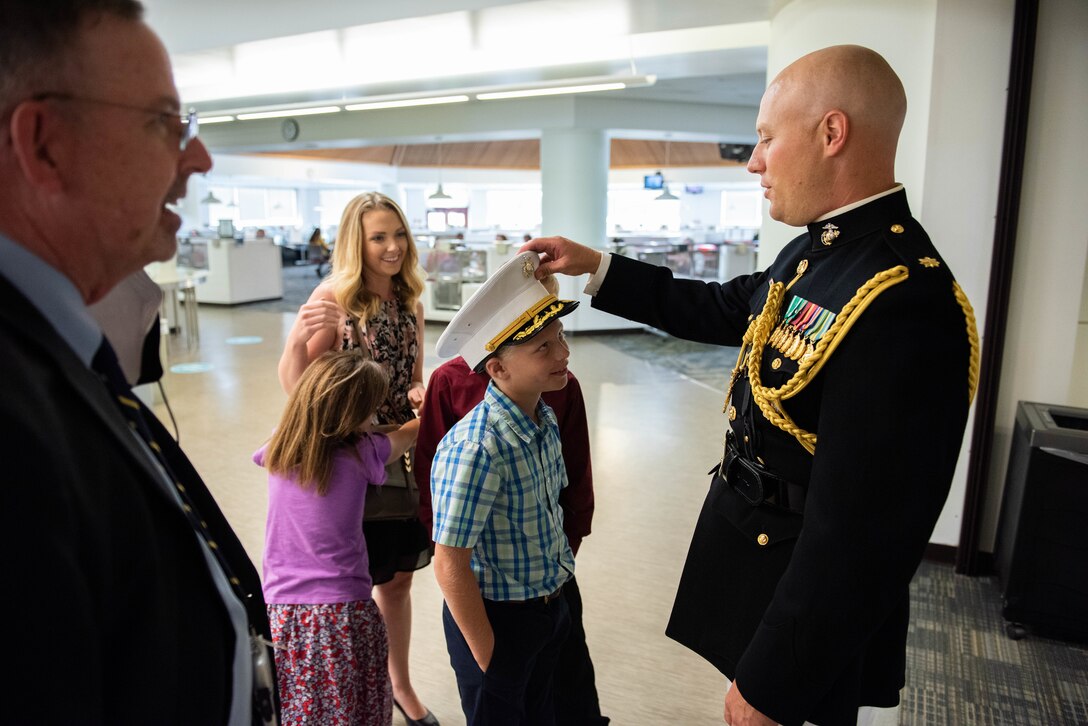 Family and friends of Navy Rear Adm. Kristen Fabry gather for a light breakfast prior to the Defense Logistics Agency Land and Maritime Change of Command and Retirement Ceremony July 22. Fabry is retiring this month after 31 years of service in the Navy.