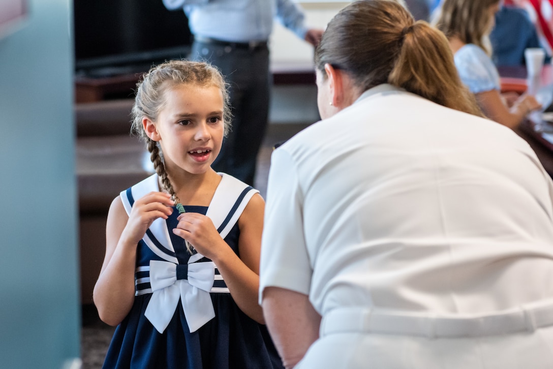 Family and friends of Navy Rear Adm. Kristen Fabry gather for a light breakfast prior to the Defense Logistics Agency Land and Maritime Change of Command and Retirement Ceremony July 22. Fabry is retiring this month after 31 years of service in the Navy.