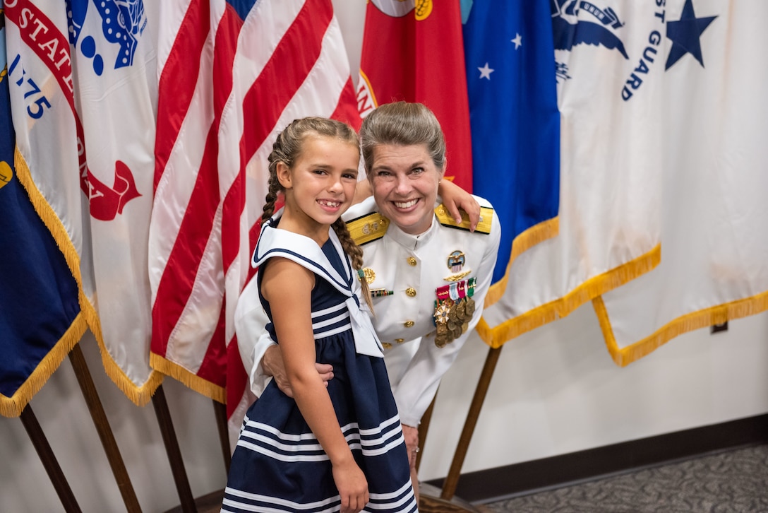 Family and friends of Navy Rear Adm. Kristen Fabry gather for a light breakfast prior to the Defense Logistics Agency Land and Maritime Change of Command and Retirement Ceremony July 22. Fabry is retiring this month after 31 years of service in the Navy.