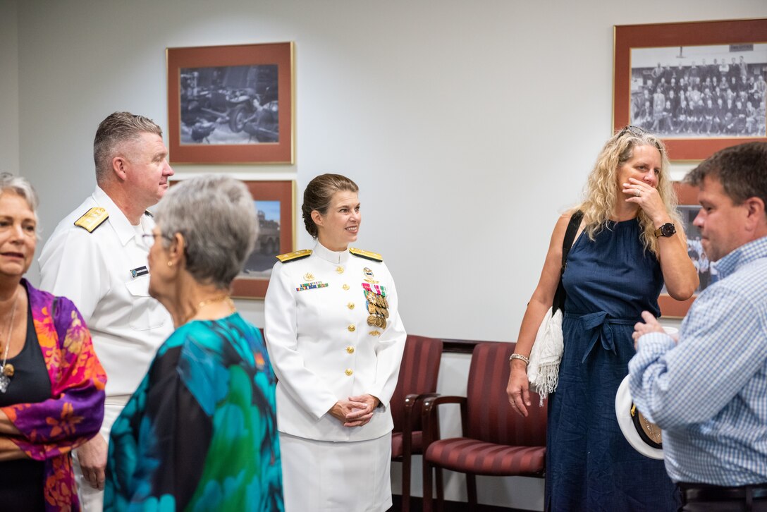 Family and friends of Navy Rear Adm. Kristen Fabry gather for a light breakfast prior to the Defense Logistics Agency Land and Maritime Change of Command and Retirement Ceremony July 22. Fabry is retiring this month after 31 years of service in the Navy.