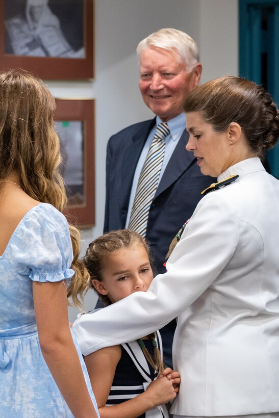 Family and friends of Navy Rear Adm. Kristen Fabry gather for a light breakfast prior to the Defense Logistics Agency Land and Maritime Change of Command and Retirement Ceremony July 22. Fabry is retiring this month after 31 years of service in the Navy.