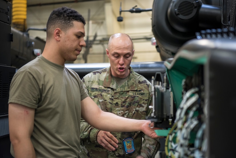 Soldiers train on a weapons system.