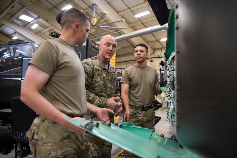 Soldiers train on a weapons system.