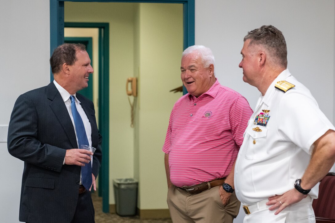 Friends, colleagues and family of Navy Rear Adm. Kristen Fabry gather for a light breakfast prior to the Defense Logistics Agency Land and Maritime Change of Command and Retirement Ceremony July 22. Fabry is retiring this month after 31 years of service in the Navy.