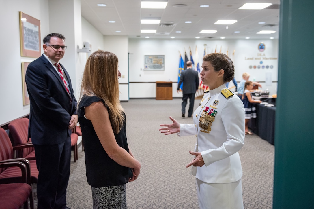 Friends, colleagues and family of Navy Rear Adm. Kristen Fabry gather for a light breakfast prior to the Defense Logistics Agency Land and Maritime Change of Command and Retirement Ceremony July 22. Fabry is retiring this month after 31 years of service in the Navy.
