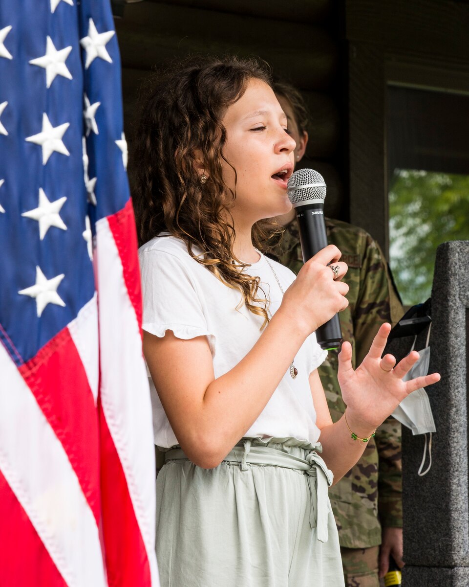 Charlotte Spaulding sings the national anthem.