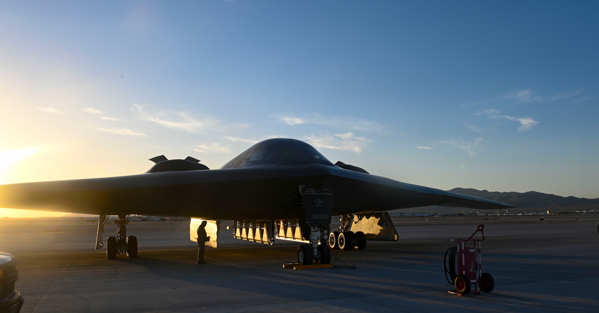 U.S. Air Force B-2 Spirit crew chiefs assigned to the 509th Aircraft Maintenance squadron prepare a B-2 Spirit for takeoff at Nellis Air Force Base, Nevada, June 6, 2022. The 325th Weapons School works directly with the 509th Bomb Wing and the 131st Bomb Wing to produce two to three graduates every six months that are B-2 Spirit pilots. (U.S. Air Force photo by Staff Sgt. Alexandria Lee)