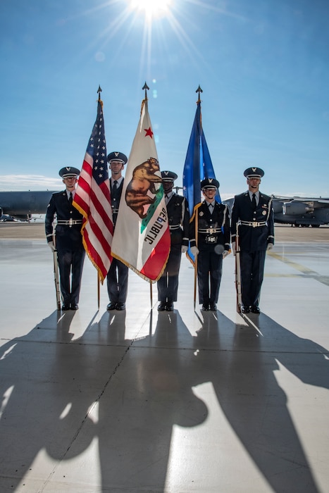 The Travis Elite Honor Guard participates during the 60th Air Mobility Wing change of command ceremony at Travis Air Force Base, California, July 27, 2022. A change of command ceremony is a military tradition of formal transfer of command, responsibilities and authority from one commander to another. (U.S. Air Force photo by Heide Couch)