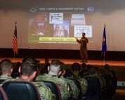 Chief Master Sgt. Tori Jones, 5th Bomb Wing Command Chief, shares her priorities and values to base personnell  during an all call at the base theater on Minot Air Force Base, North Dakota, July 25, 2022. Airmen were introduced to new base leadership and had the opportunity to address hot topic questions. (U.S. Air Force photo by Airman Alysa Knott)