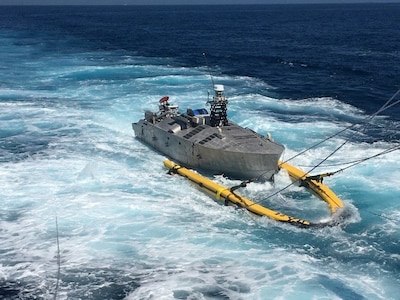 Minecountermeasure Unmanned Surface Vehicle (MCM USV) is recovered onboard USS Manchester (LCS 14) during Unmanned Influence Sweep System (UISS) Initial Operational Test & Evaluation (IOT&E) June 2021. The UISS recently achieved Initial Operating Capability (IOC).