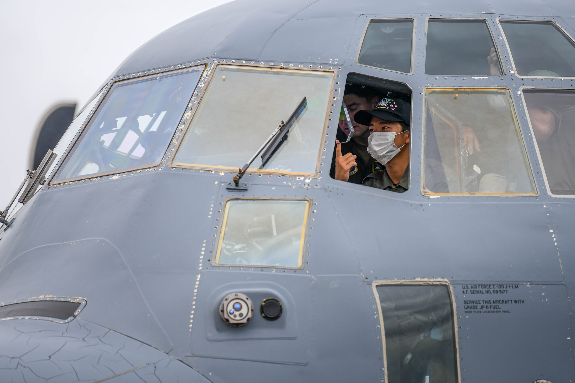 A cadet sits in a C-130J pilot’s seat