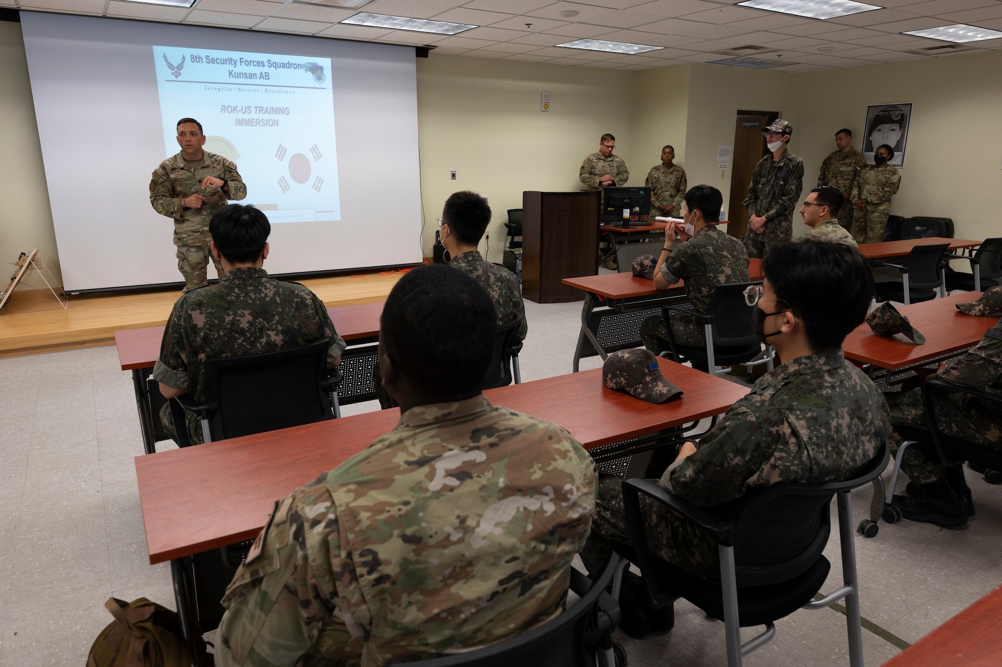 Lt. Col. Jesse A. Goens speaks to ROKAF and USAF Airmen about the immersion training.
