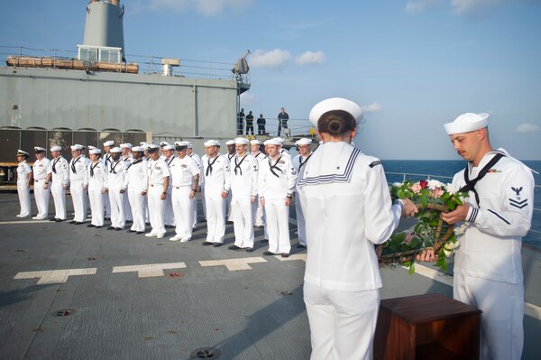 JAVA SEA (July 25, 2022) – Sailors assigned to the Emory S. Land-class submarine tender USS Frank Cable (AS 40) participate in a wreath laying ceremony in the Java Sea, July 25, 2022. The ceremony was in honor of the 53 Indonesian National Military-Naval Force Sailors lost aboard the Indonesian Cakra-class diesel-electric attack submarine KRI Nanggala (402) that sunk, April 21, 2021, off the coast of Bali. Frank Cable is currently on patrol conducting expeditionary maintenance and logistics in the U.S. 7th Fleet area of operations in support of a free and open Indo-Pacific. (U.S. Navy photo by Mass Communication Specialist 3rd Class Wendy Arauz)
