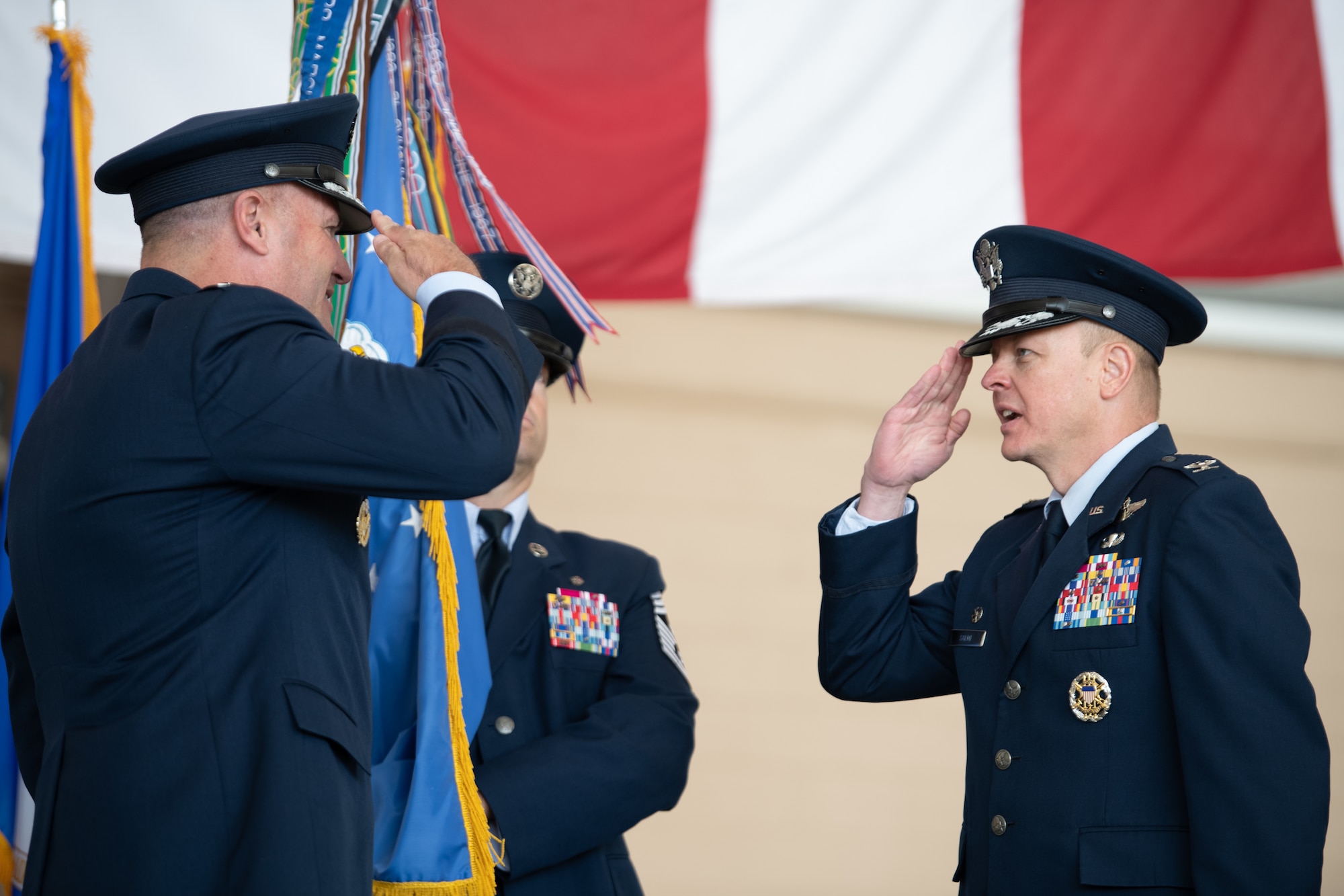 Higher ranking Airmen salute each other.