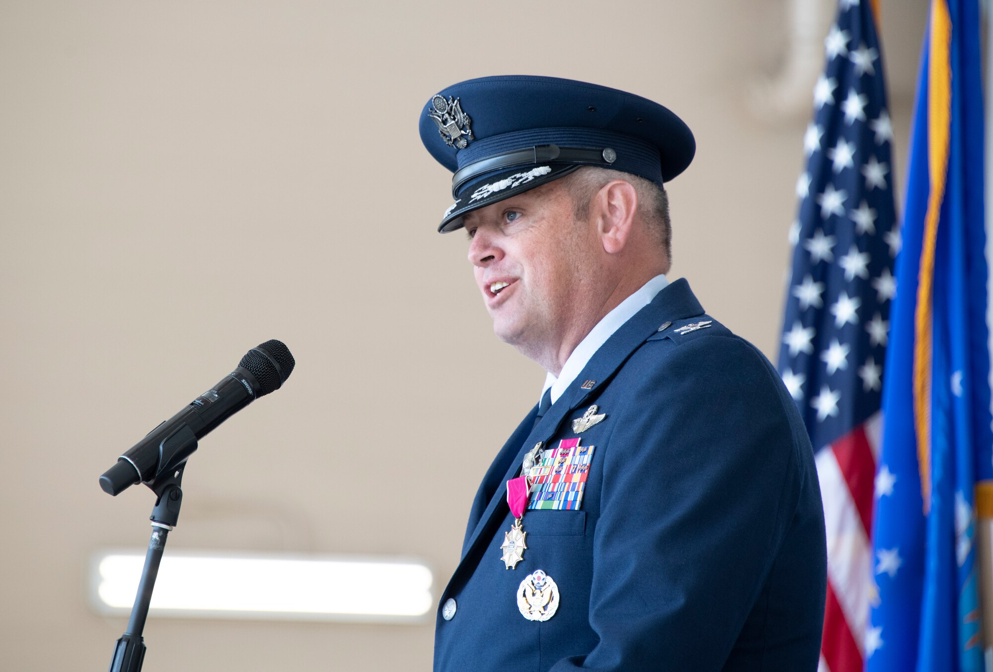 U.S. Air Force Col. Corey Simmons, outgoing 60th Air Mobility Wing commander, delivers remarks during the 60th AMW change of command ceremony at Travis Air Force Base, California, July 27, 2022. A change of command ceremony is a military tradition of formal transfer of command, responsibilities and authority from one commander to another. (U.S. Air Force photo by Heide Couch)