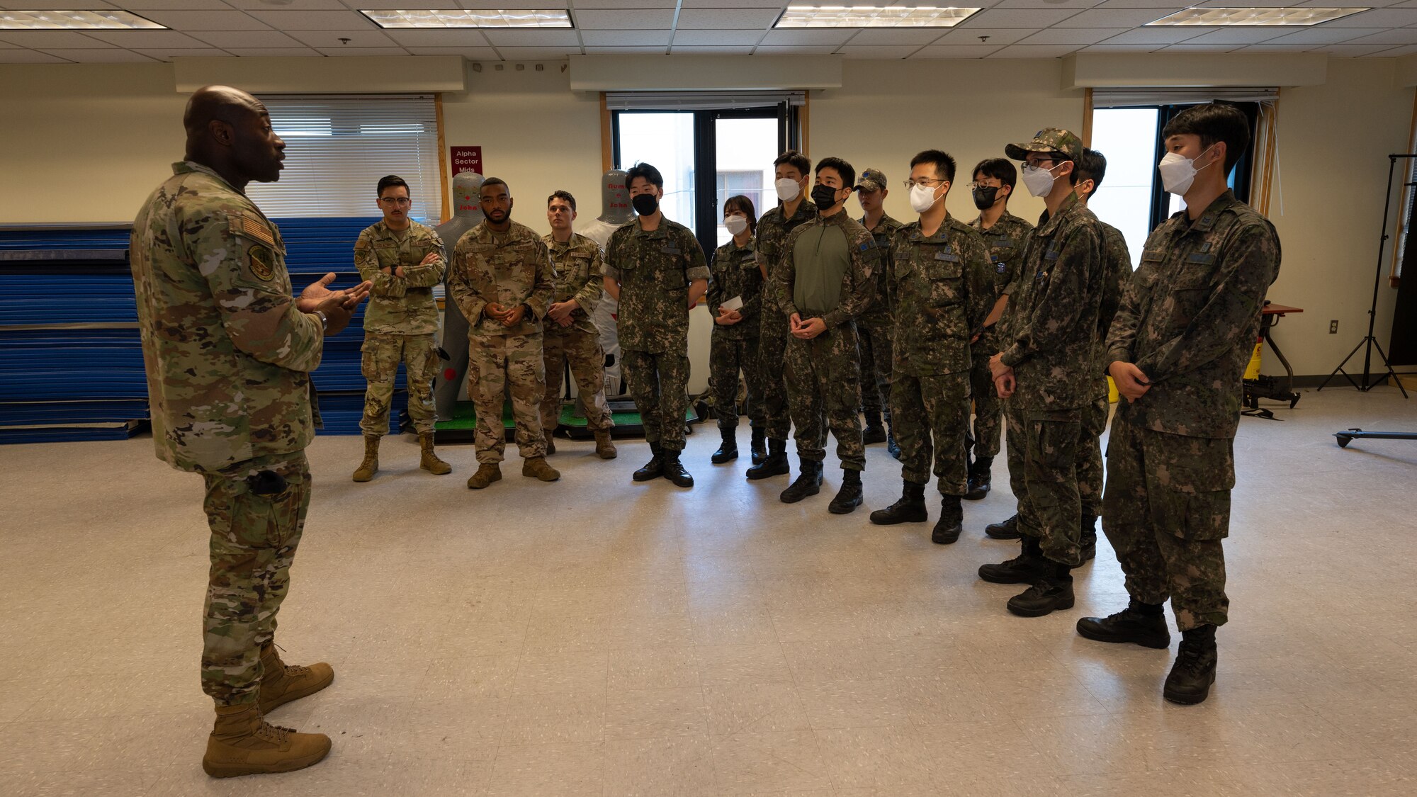 Master Sgt. Michael Denson speaks to ROKAF and USAF Airmen.