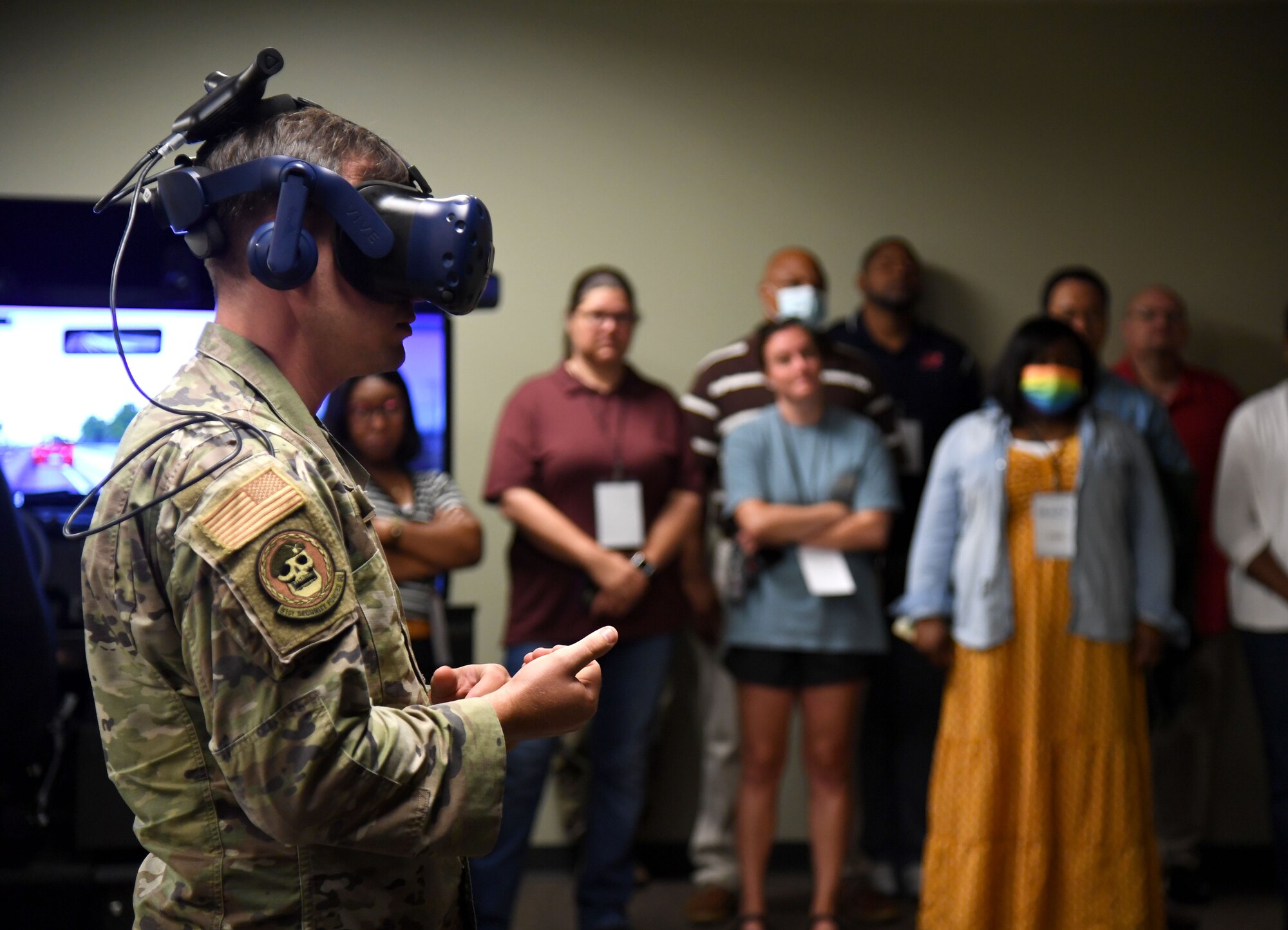 U.S. Air Force Staff Sgt. John James, 81st Security Forces Squadron unit trainer, provides a virtual reality training demonstration during the Mississippi Educators Tour for Law and Public Safety and Fire Science tour inside the 403rd Security Forces Squadron Combat Arms building at Keesler Air Force Base, Mississippi, July 27, 2022. More than 30 educators also toured the Keesler Fire Department and received a military working dog demonstration. (U.S. Air Force photo by Kemberly Groue)