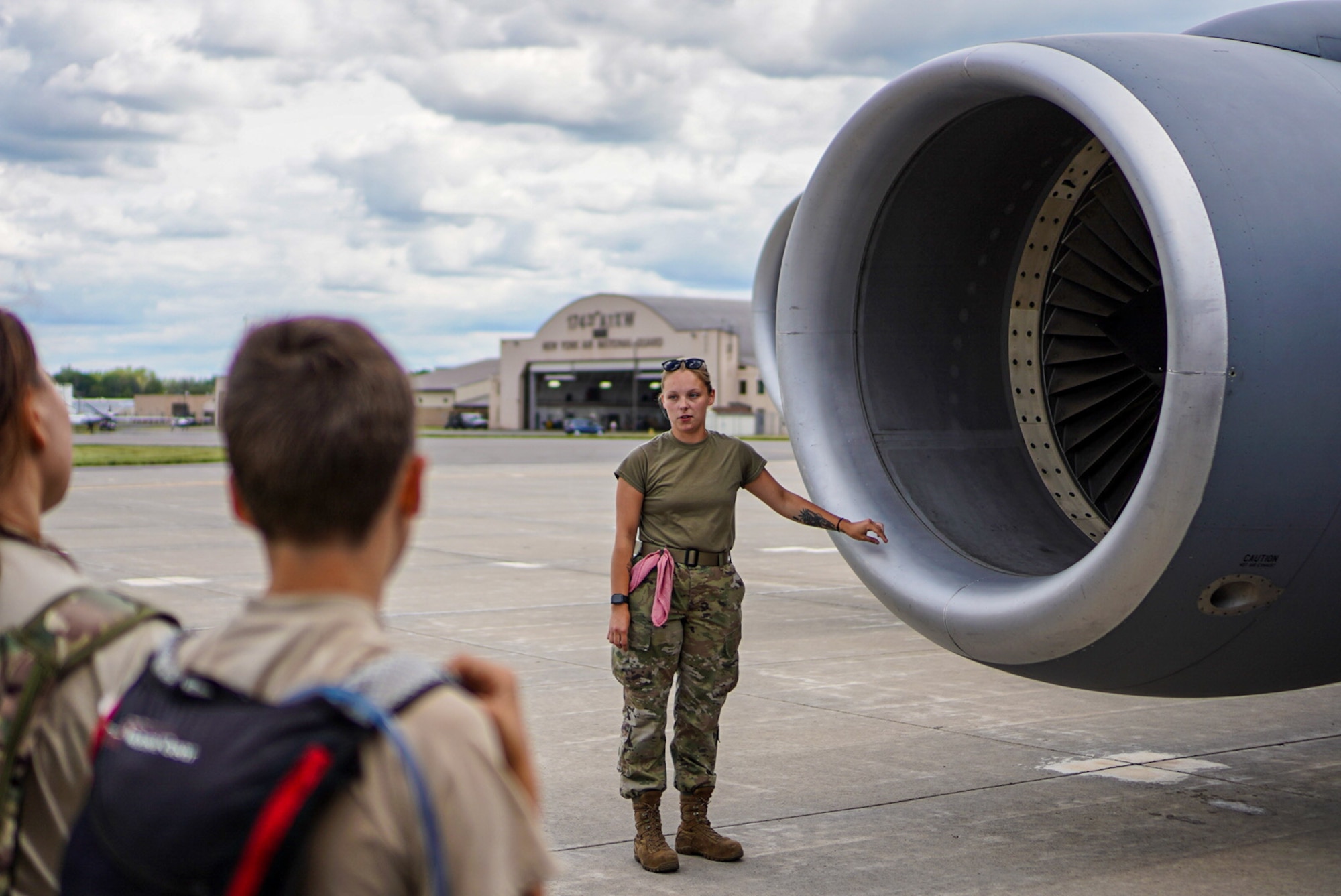 Crew chief teaches cadets about aircraft engine