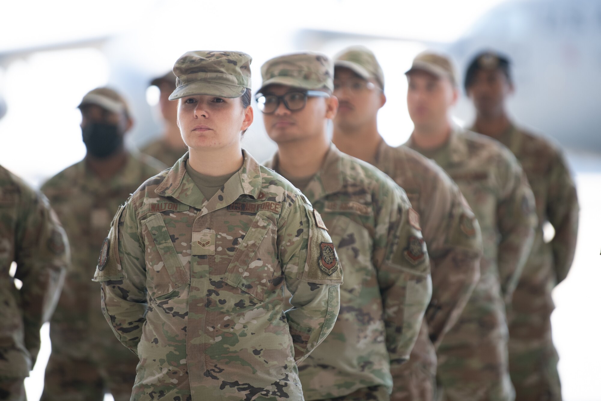 Airmen standing at ease in formation.
