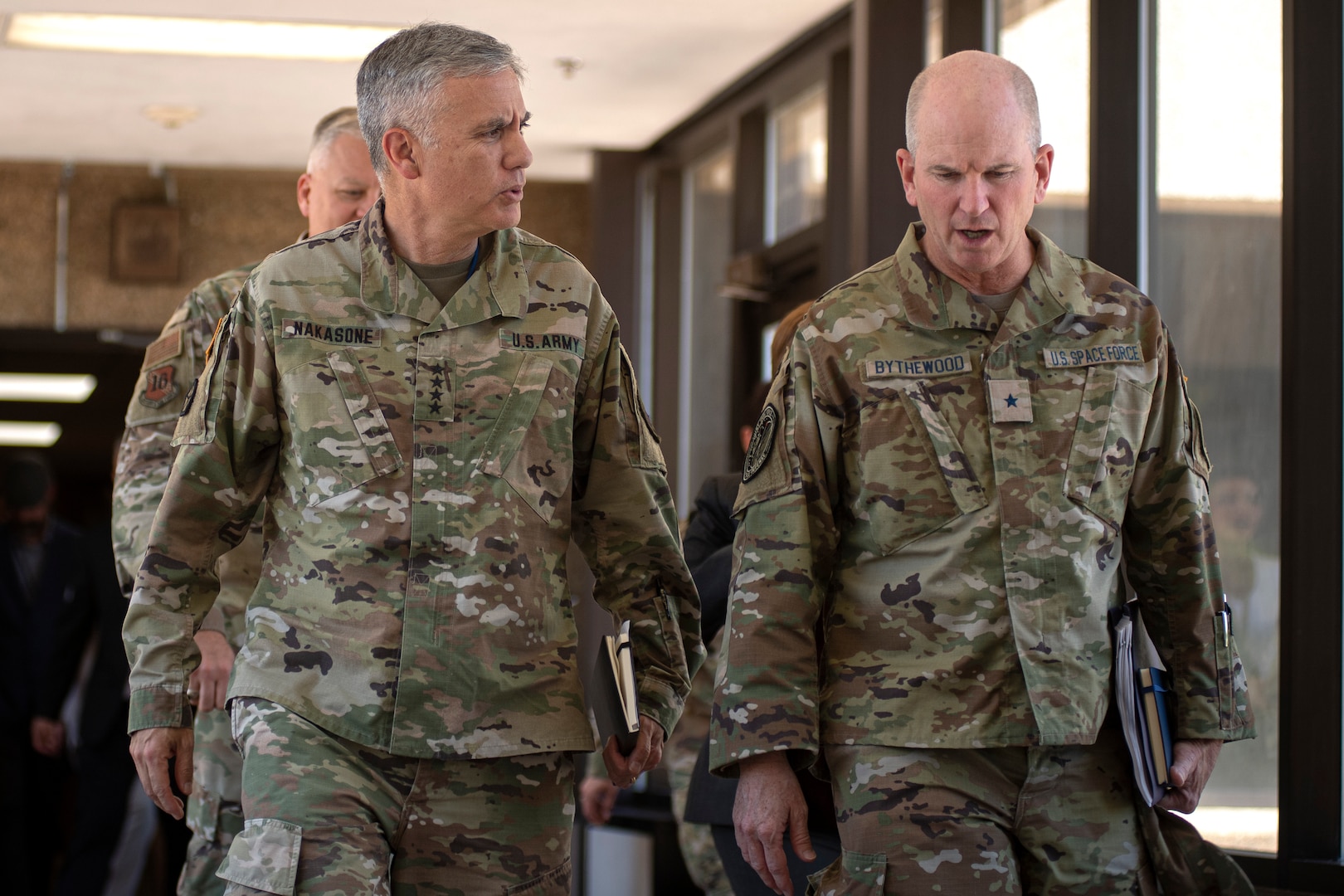 Two military men walking in uniform