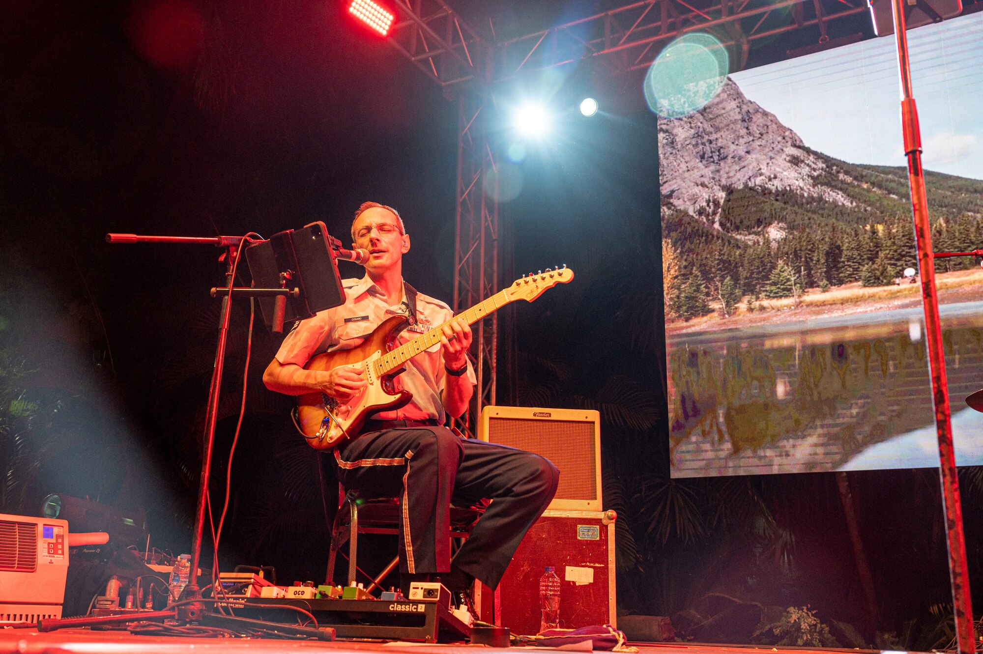 U.S. Air Force Staff Sgt. Alberto Cosano, Air Forces Central Band guitarist, plays a guitar solo at the U.S. Embassy-Egypt Independence Day celebration in Cairo, Egypt, July 20, 2022.