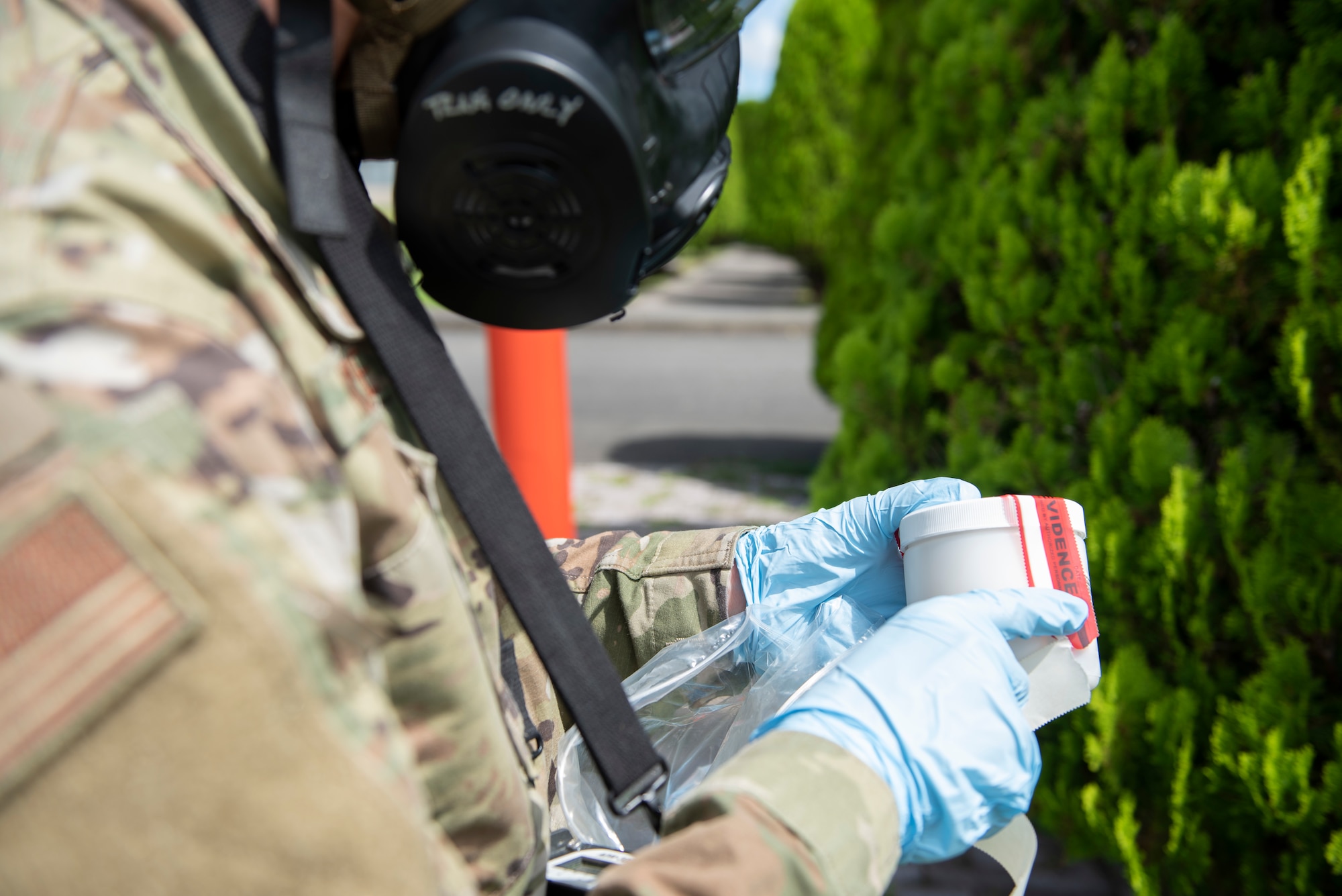 Senior Airman Andrew McClure, 188th Civil Engineer Squadron emergency management specialist, seals a soil sample container during a chemical, biological, radioactive and nuclear site survey training at the Sagami General Depot, Japan. The 188th CES from Ebbing Air National Guard Base, Arkansas, and 138th Civil Engineer Squadron from Tulsa Air National Guard Base, Oklahoma, visited Yokota Air Base, Japan, for a three-week training mission to train on specialized equipment unique to the local area. (U.S. Air Force photo by Tech. Sgt. Joshua Edwards)