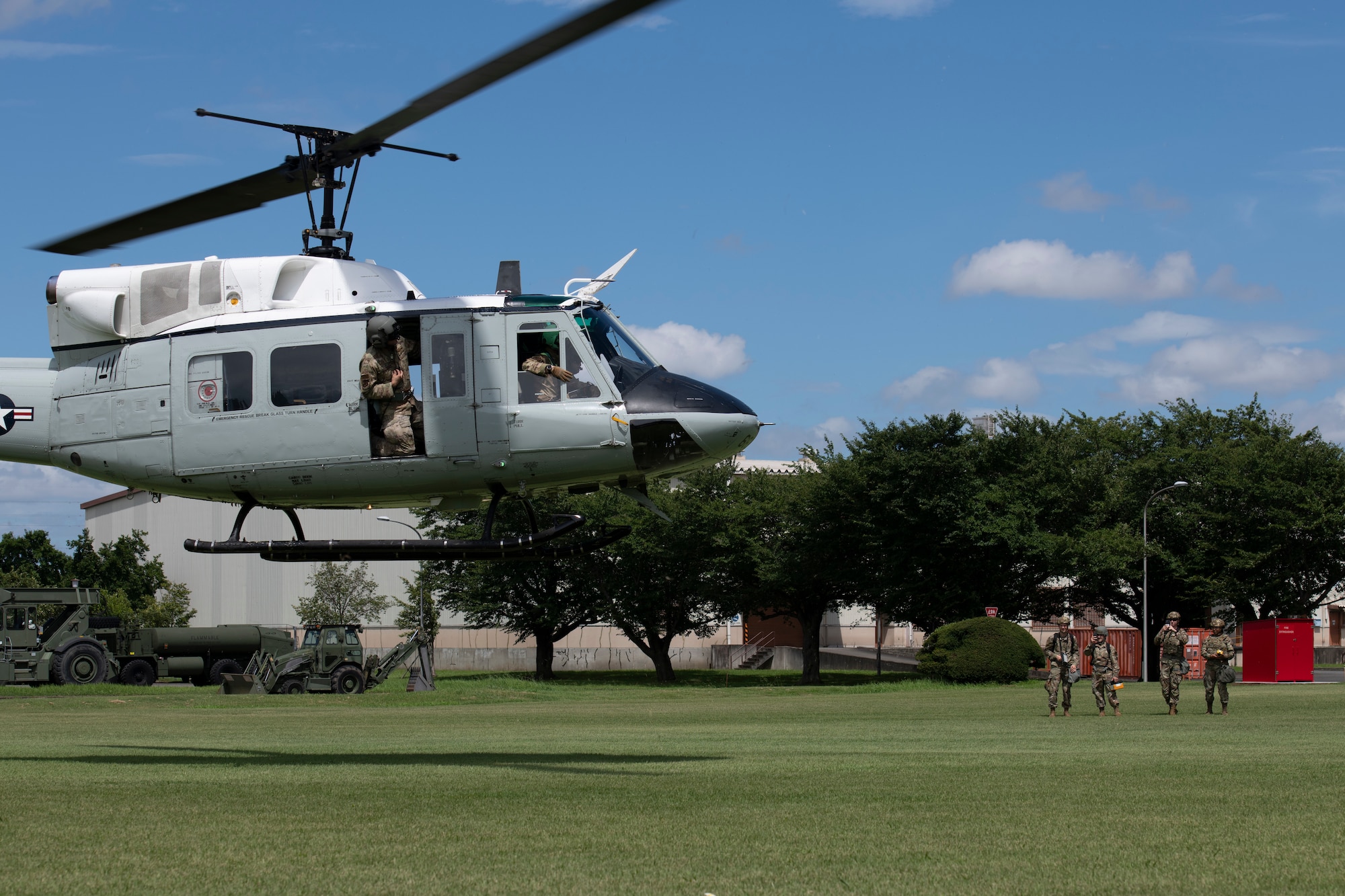 A 459th Airlift Squadron UH-1N Iroquois takes off after dropping off 188th Civil Engineer Squadron from Ebbing Air National Guard Base, Arkansas, and 374th Civil Engineer Squadron Airmen for a chemical, biological, radioactive and nuclear site survey training at the Sagami General Depot, Japan. Once on the ground, the Airmen had to sweep the landing zone utilizing various specialized equipment that could be implemented during real-world events. (U.S. Air Force photo by Tech. Sgt. Joshua Edwards)
