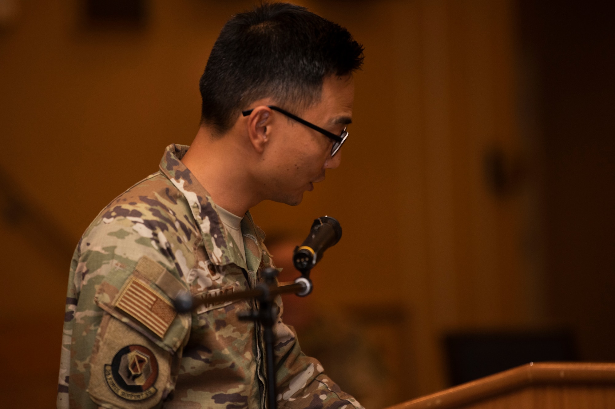 People in uniform perform an assumption of command indoors