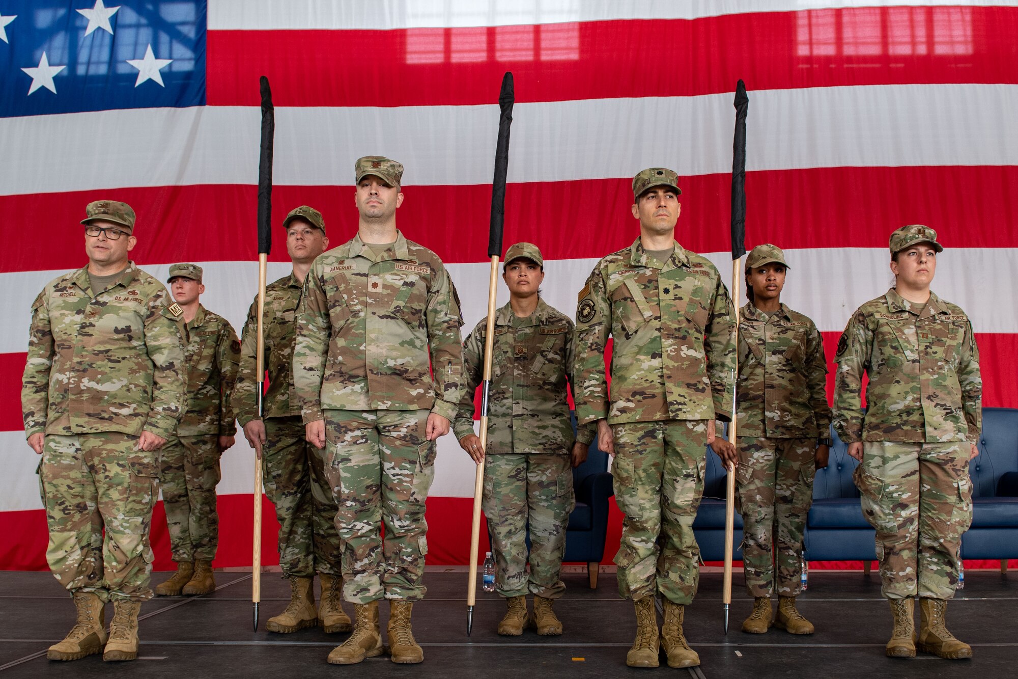 Airmen from the 31st Maintenance Group present the official guidons for the newly activated squadrons during the 31st MXG Reorganization Ceremony