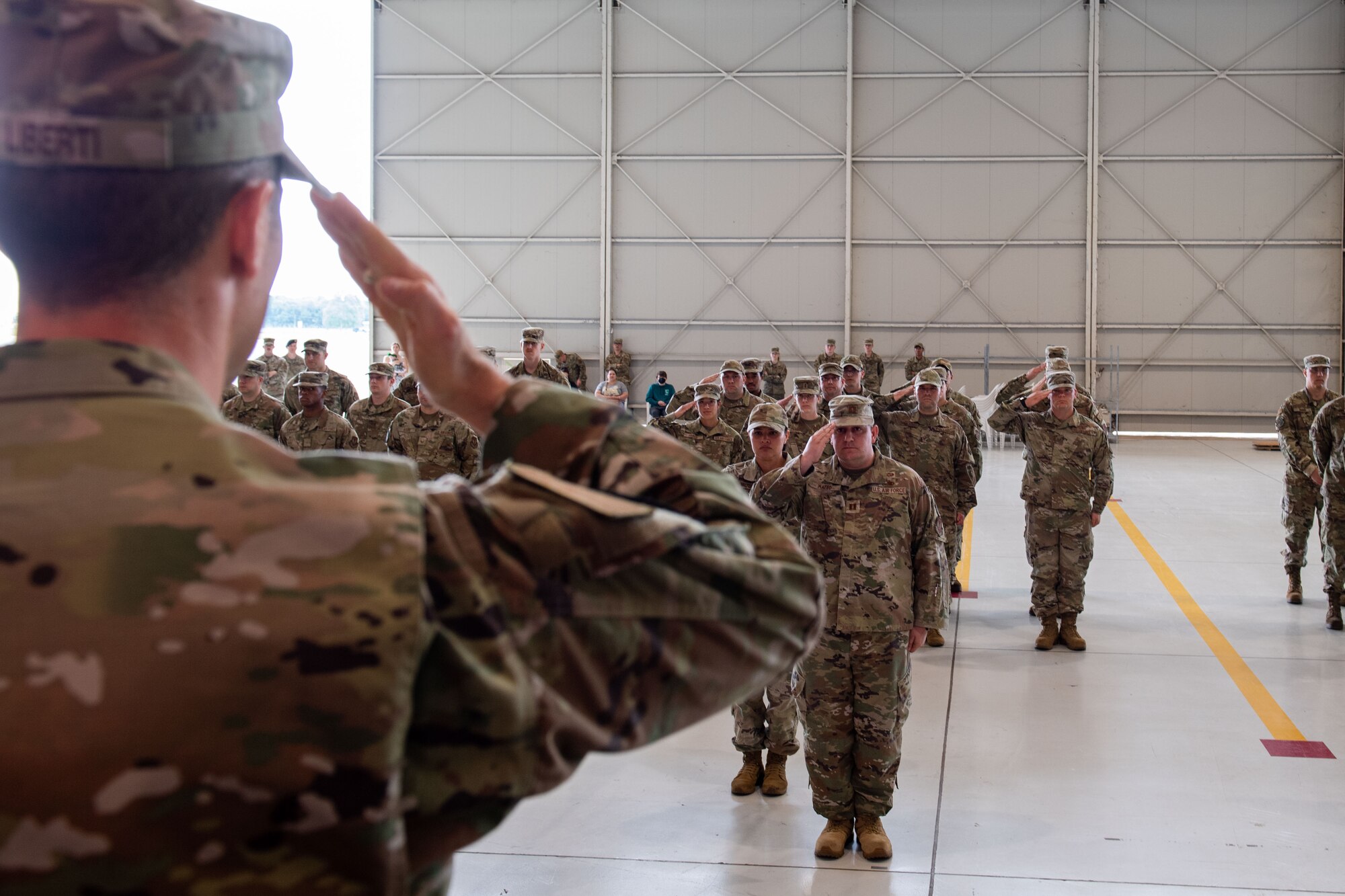 U.S. Air Force Capt. Casey Schindling, 56th Rescue Generation Squadron incoming commander, accepts her first salute as incoming commander