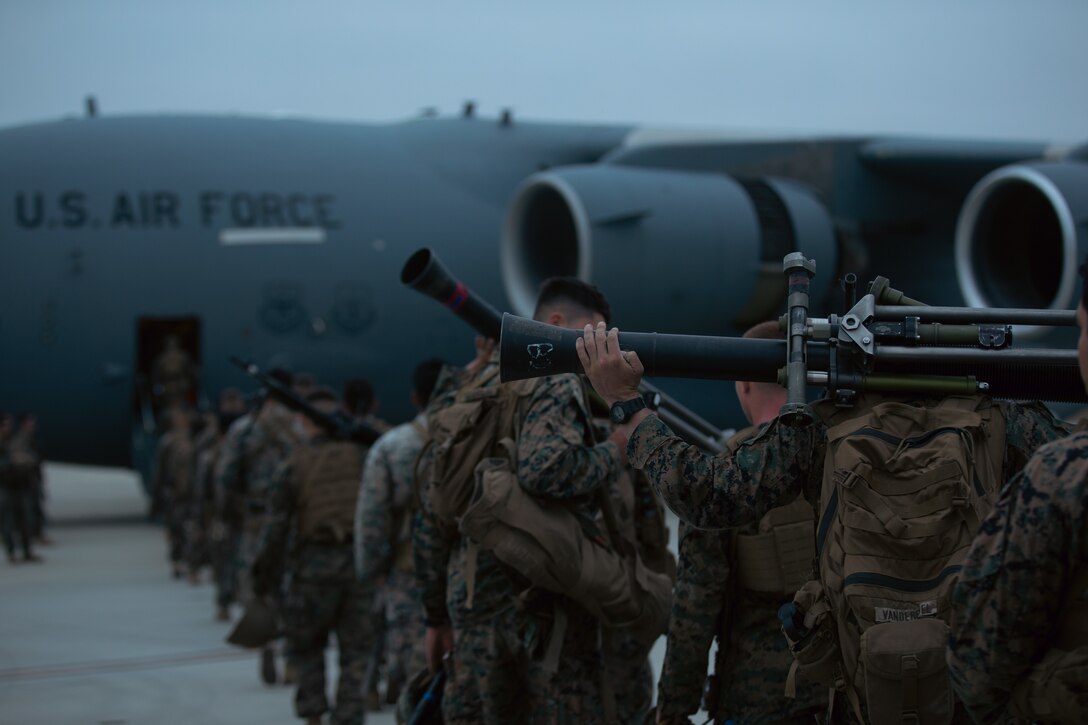 U.S. Marines with 3rd Battalion, 5th Marine Regiment, 1st Marine Division board a U.S. Air Force C-17 Globemaster III aircraft during a joint training exercise on Marine Corps Air Station Camp Pendleton, California, July 25, 2022. This exercise included aircraft from five different Air Force squadrons and Marines with 3/5, 1st MarDiv to enhance their expeditionary operations in a joint-training environment. This was the first time MCAS Camp Pendleton staged five C-17 Globemaster III aircraft on the air station at one time. (U.S. Marine Corps photo by Cpl. Shaina Jupiter)