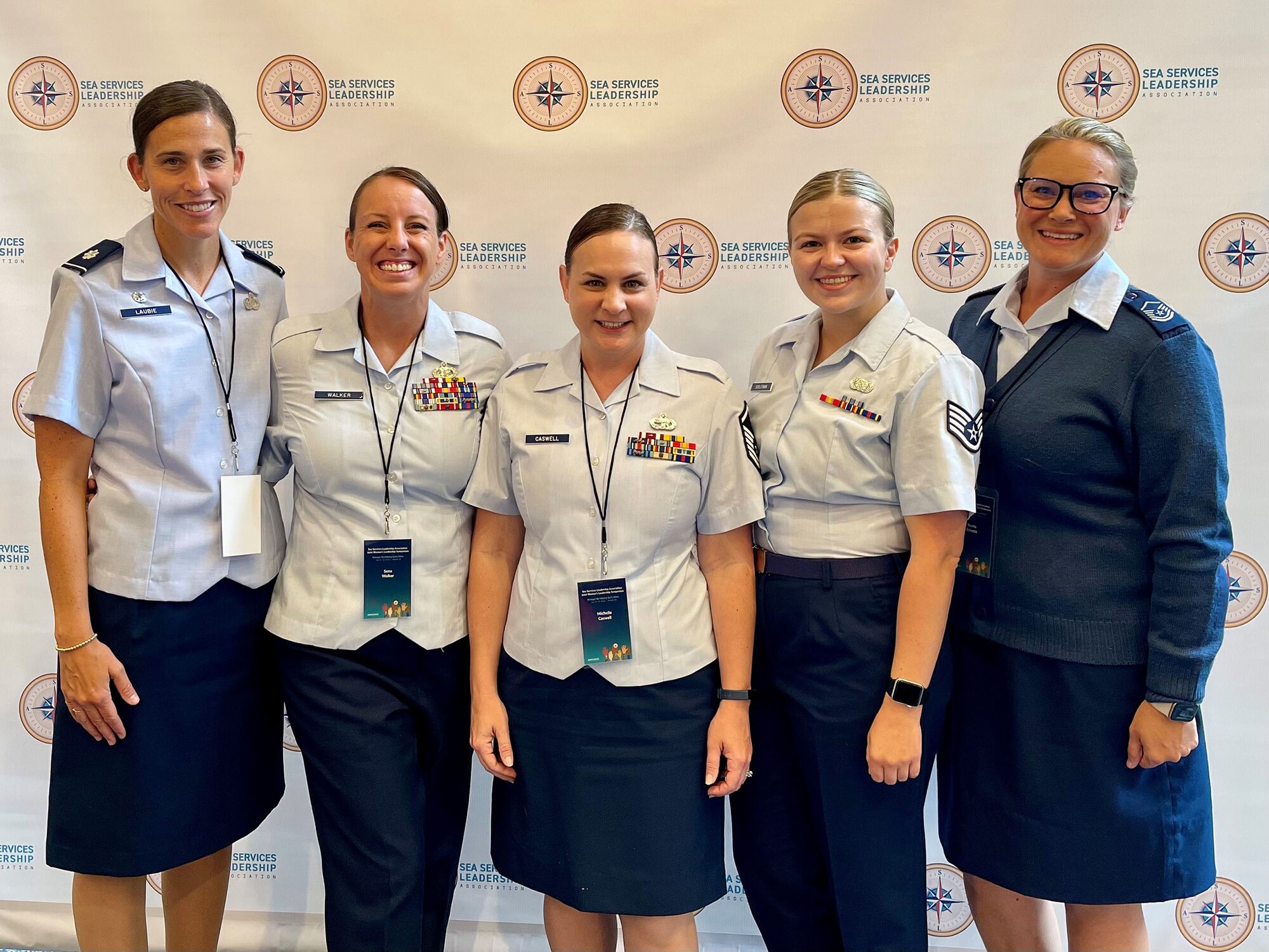 From left to right: Lt. Col. Miranda Laubie, 445th Force Support Squadron, Senior Master Sgt. Sena Walker, 445th Operations Group, Master Sgt. Michelle Caswell, 445th FSS, Staff Sgt. Casey Schlotman,445th Logistics Readiness Squadron and Master Sgt. Kerrie Schutte, 445th OG, pose for a photo. Five Airmen from the 445th Airlift Wing attended the Joint Women's Leadership Symposium, a two-day event hosted by the Sea Services Leadership Association, July 11-12, 2022 in Norfolk, Virginia. More than 800 attendees from all branches of the U.S. Armed Forces and coalition forces participated.